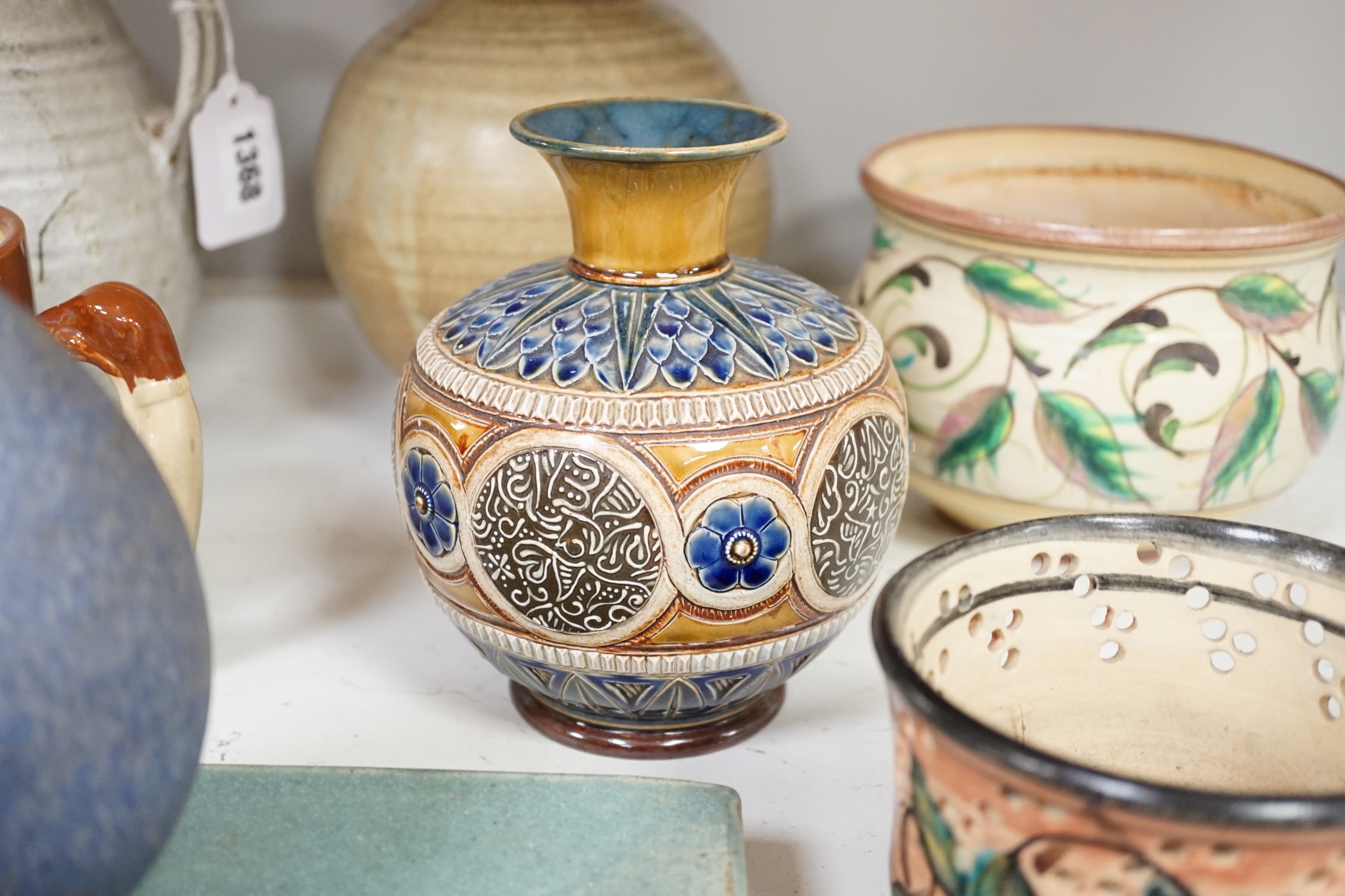 A quantity of mixed studio pottery, two Doulton vases, a large Bourne mug, a Roman style lamp, etc (19)
